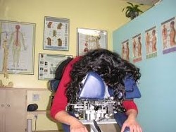 Picture of a women laying on chiropractic table